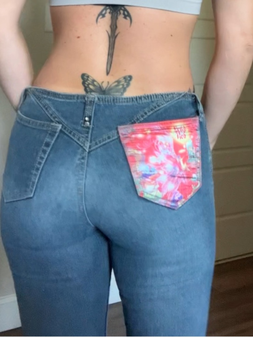 Vintage Blue High-Waist Jeans with Colorful Pocket Accent
